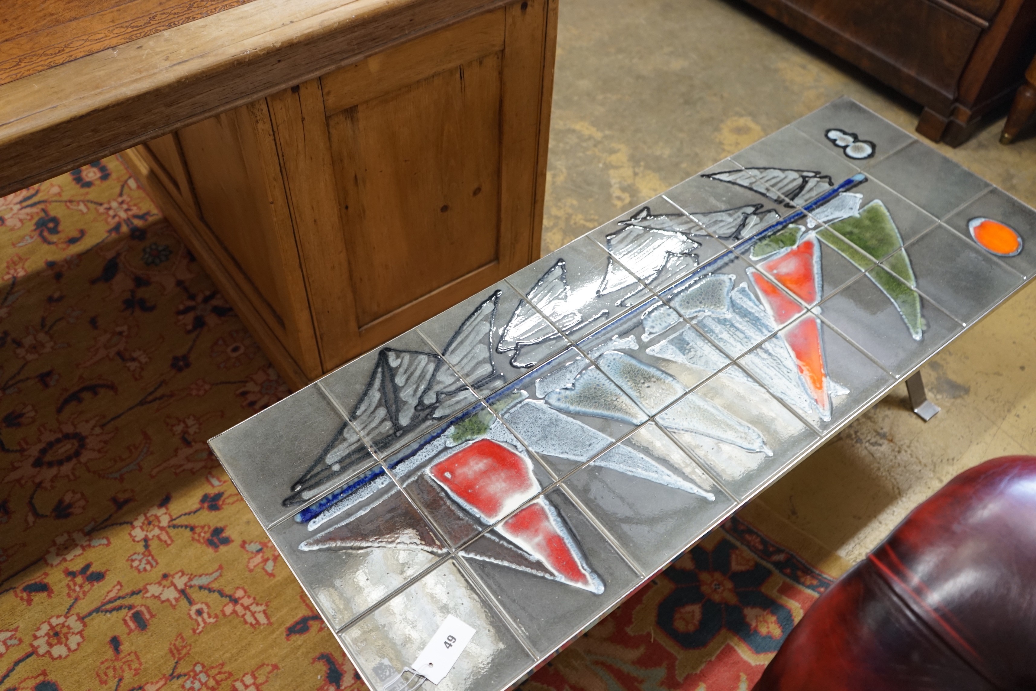 A 1960's Adri Belgique tiled topped rectangular chrome coffee table with wood stretcher, width 124cm, depth 47cm, height 42cm